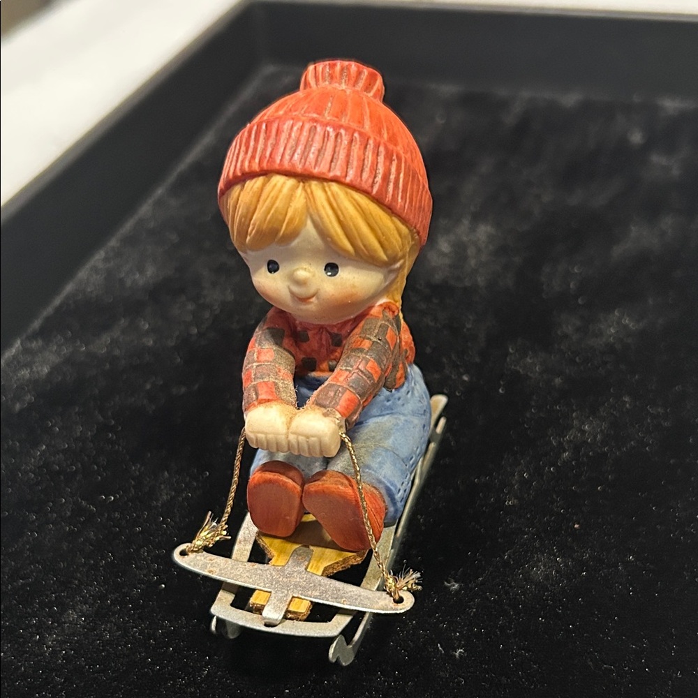 Vintage Enesco “Katie On A Sled”Porcelain & Metal Figurine, 4”